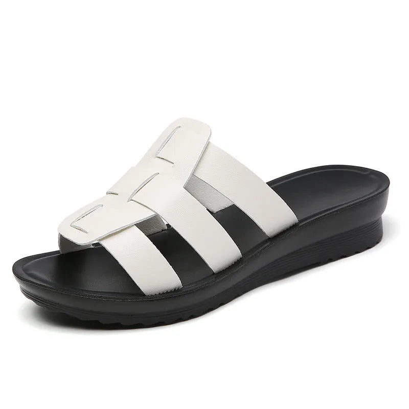 Beige women's flat bottom slippers with viscose upper and PU leather sole.