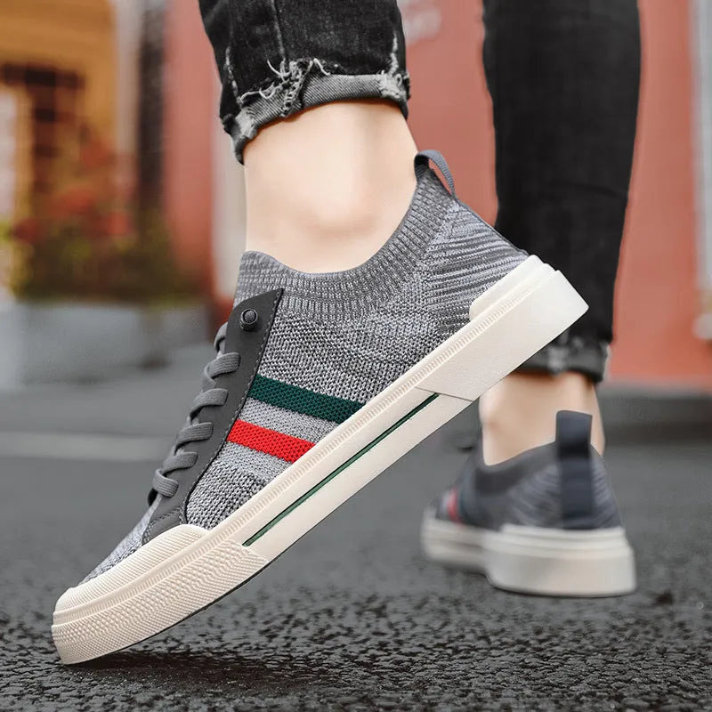 Beige men's low-top casual sneakers with mesh upper, elastic band, and flat rubber sole.