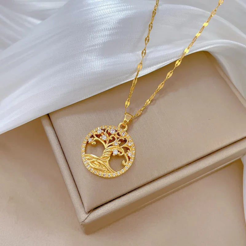 Gold-coloured adjustable necklace with an iridescent mother-of-pearl cross pendant on a detailed lip chain.