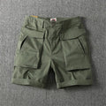 Men's straight leg cargo shorts in khaki with multiple pockets, made from micro-elastic cotton fabric.