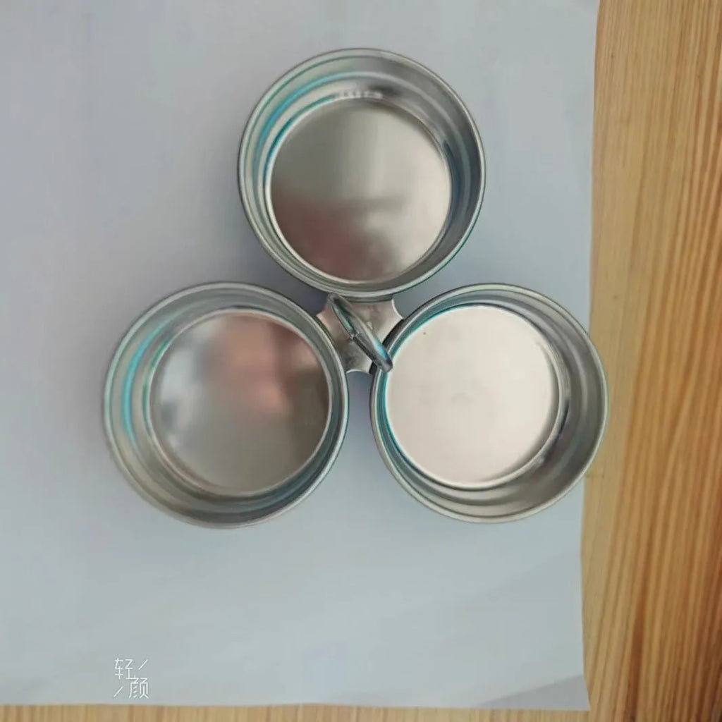 Mini heart-shaped stainless steel egg steamer for cooking a single egg.