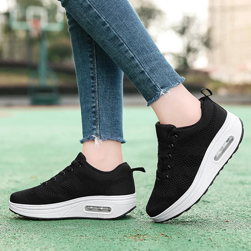 Women's solid colour flyknit platform casual shoes with an air cushion and T-shaped ribbon detail.