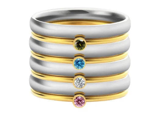 A geometric titanium steel ring with a December colour birthstone in an engraved, superimposed design.