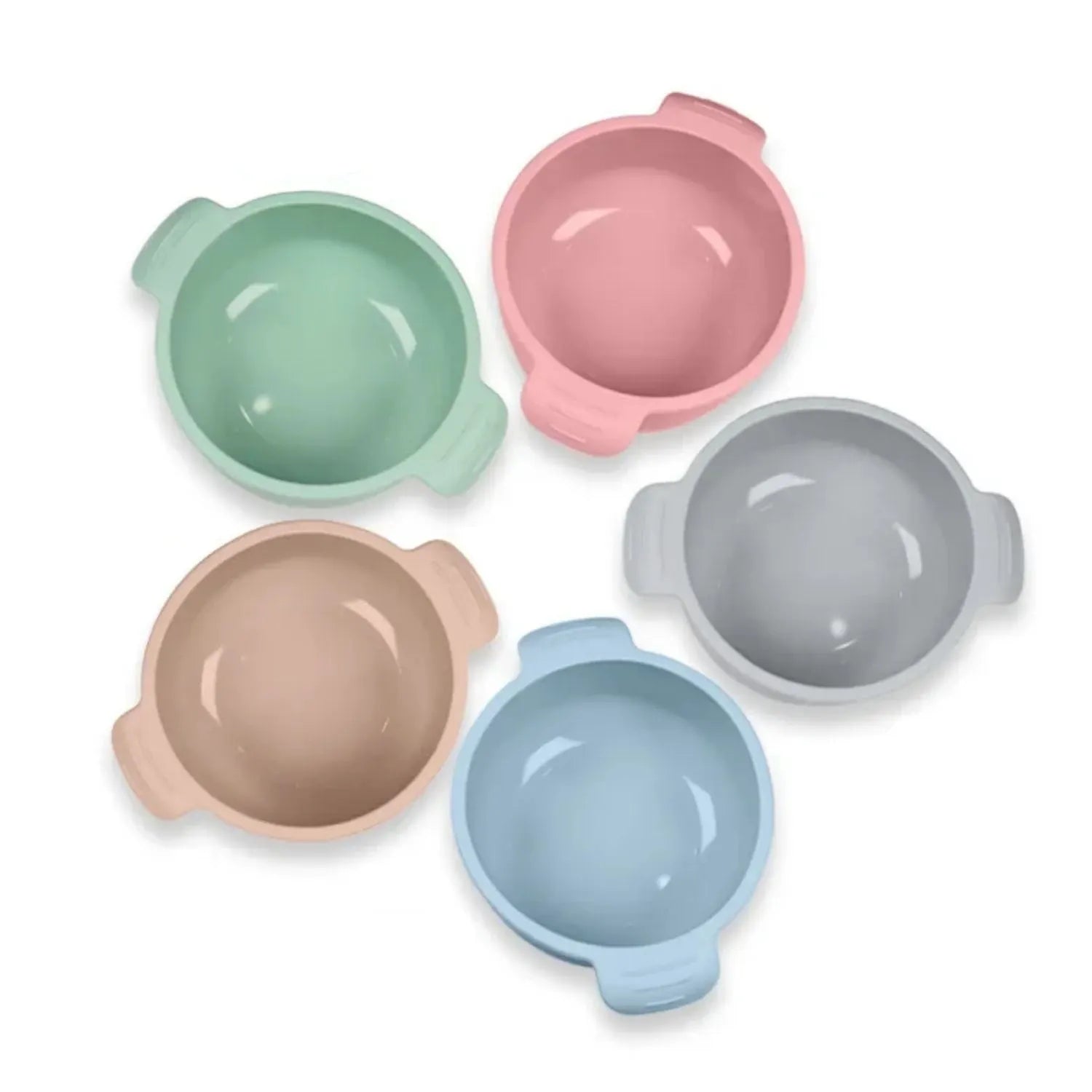 Flexible silicone pet bowl with suction cup base, shown in blue, folded flat next to a dog