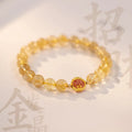 Natural citrine and gold rutilated quartz crystal bracelet with diamond-shaped beads