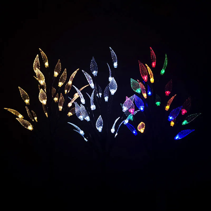 Three solar-powered garden lights with leaf branch design for lawn decoration