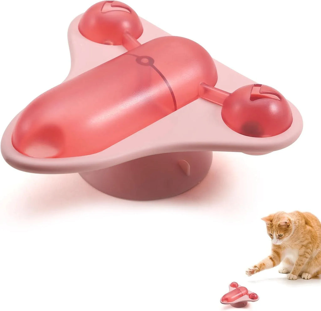 Blue interactive pet puzzle toy with spinner, bell, catnip and snack cabin on a smooth floor.