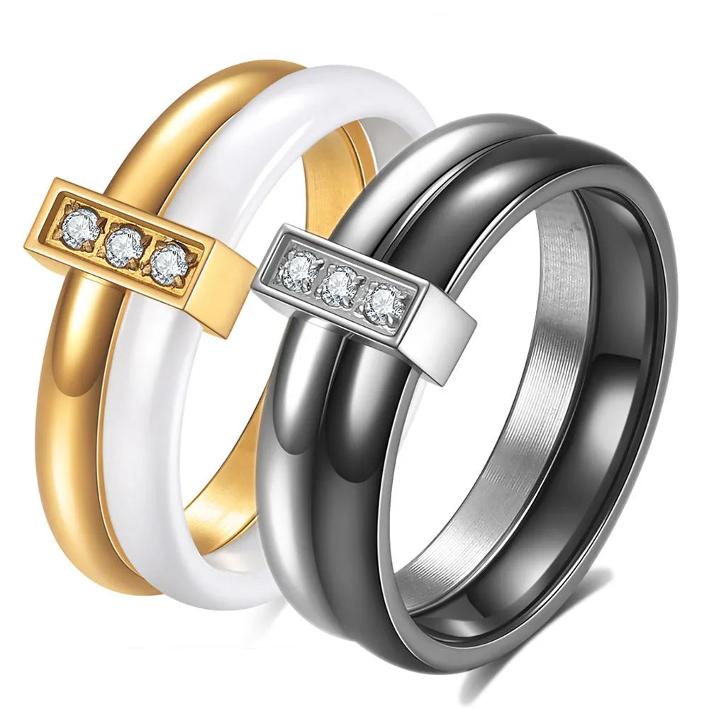 Glossy black ceramic women's ring with round inlaid detail on a 6mm wide geometric band.