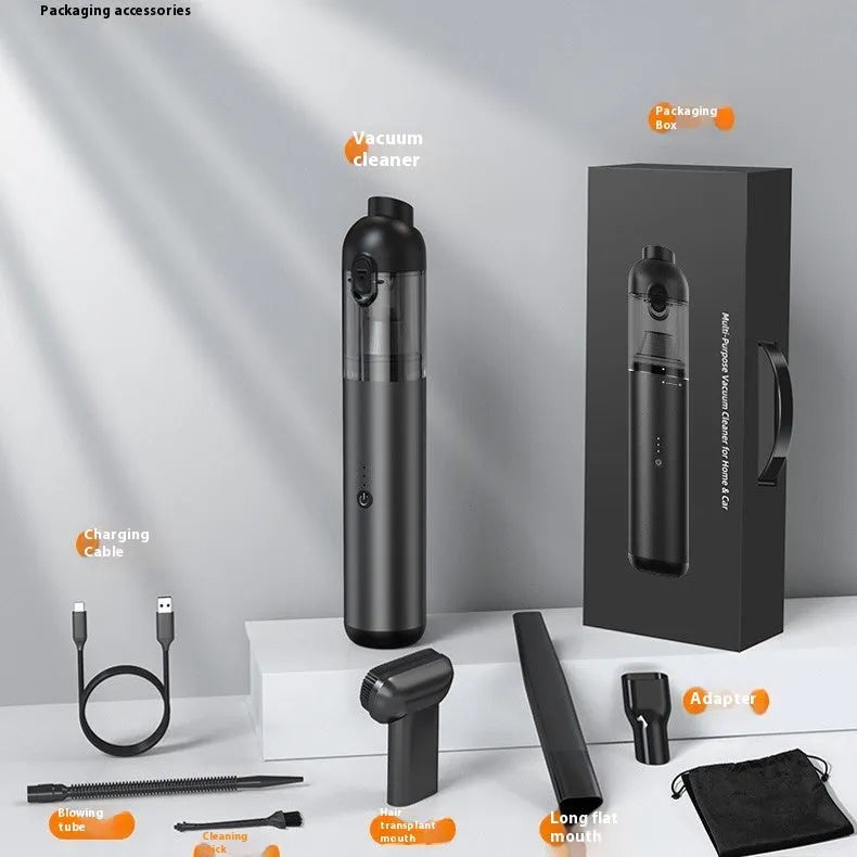 Black handheld wireless cleaner with attachments on a table, 70W rechargeable dust blower for car and home use