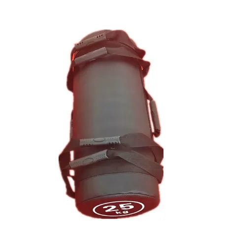 Flat white PVC fitness sandbag on gym floor, showing size and sturdy handles for weight training.