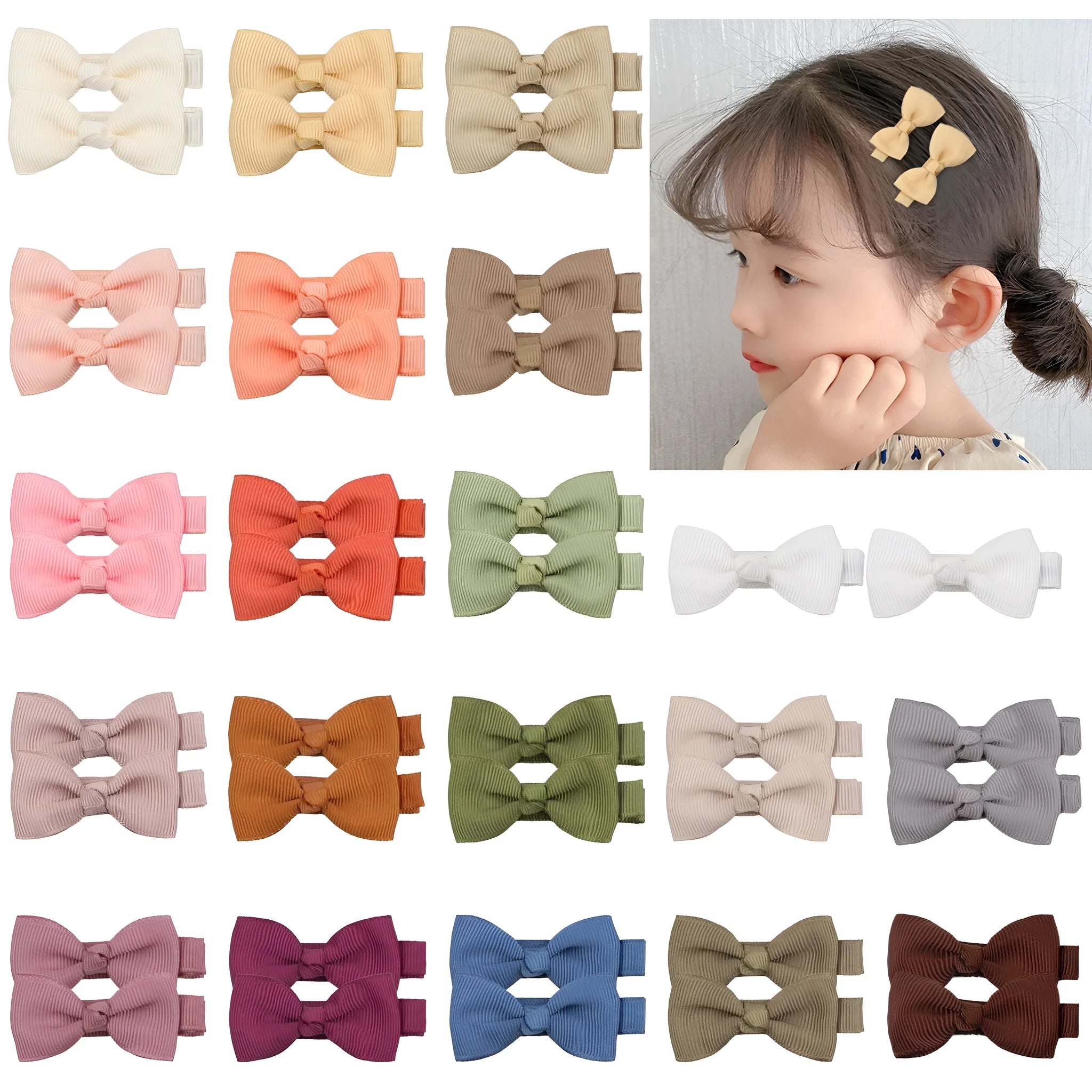 Pastel coloured baby hair clips and bows arranged by colour with non-slip lined interiors visible