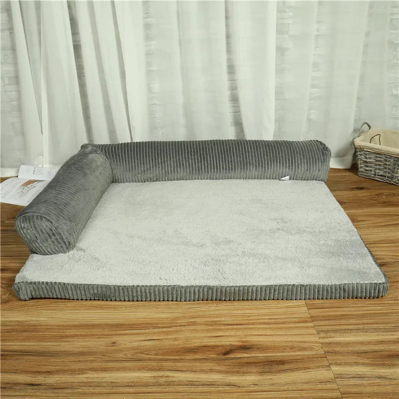 Corduroy pet dog sofa with bolster sides on a non-slip cloth base, shown in grey colour.