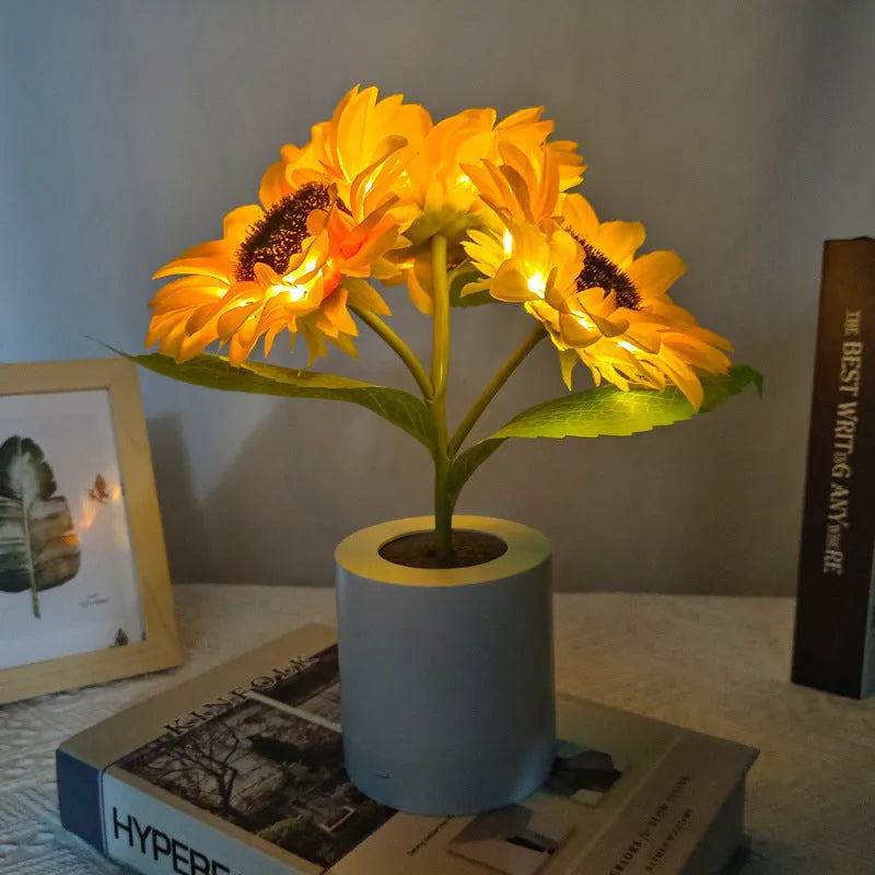 Rechargeable artificial sunflower LED night light on table with USB cable