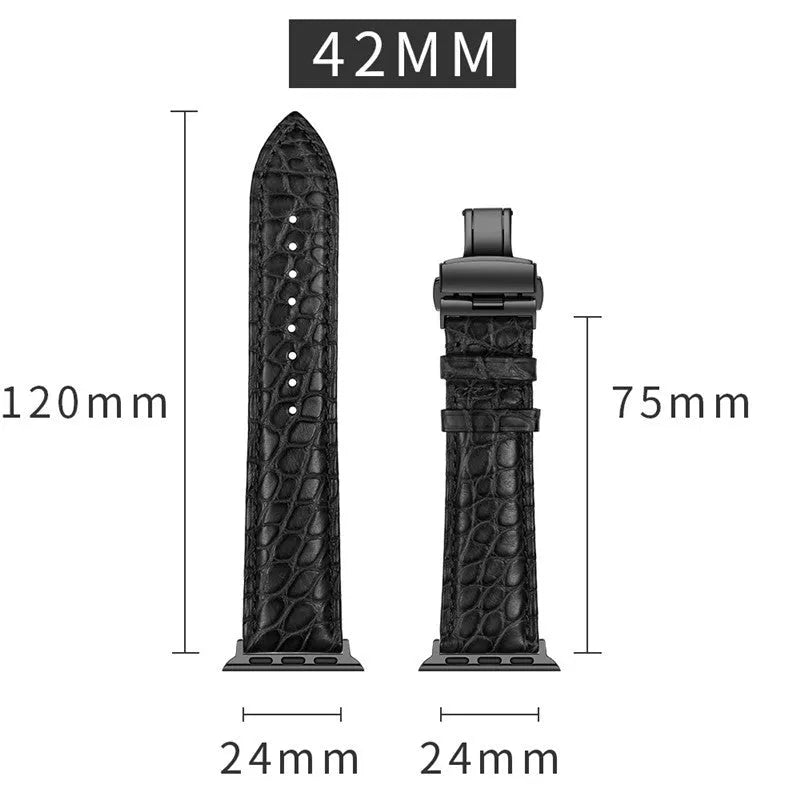 Genuine crocodile skin watch strap in brown with rose gold buckle, 42-44mm width, on a wooden surface