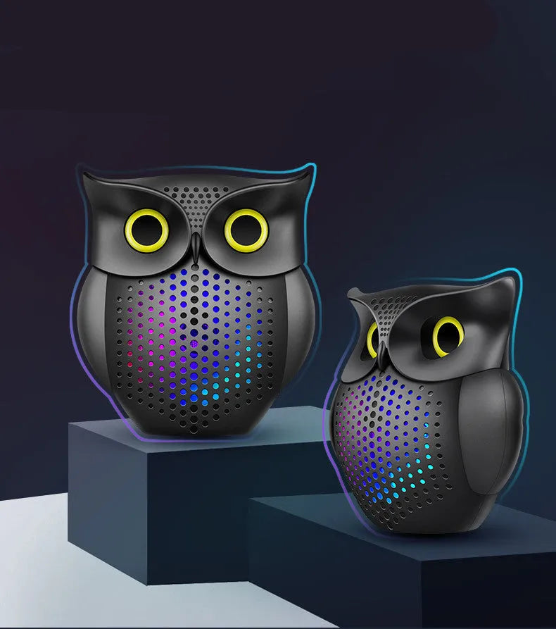 Black wireless Bluetooth speaker with a cartoon owl design on the front.