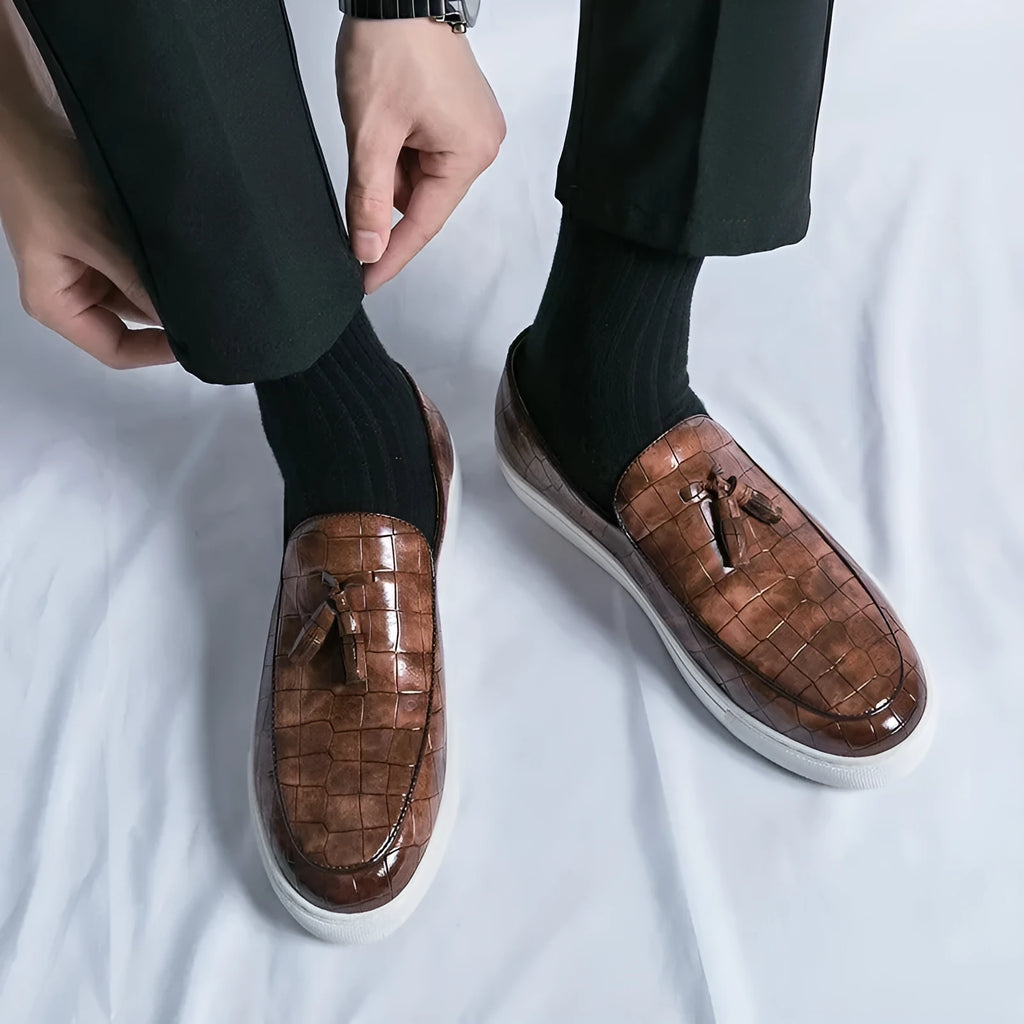 Men's plus size brown leather-look sneakers with tassel detail and rubber sole.