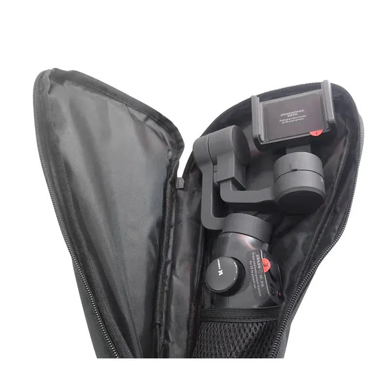 Black drawstring storage bag for mobile phone gimbal accessories on a table.