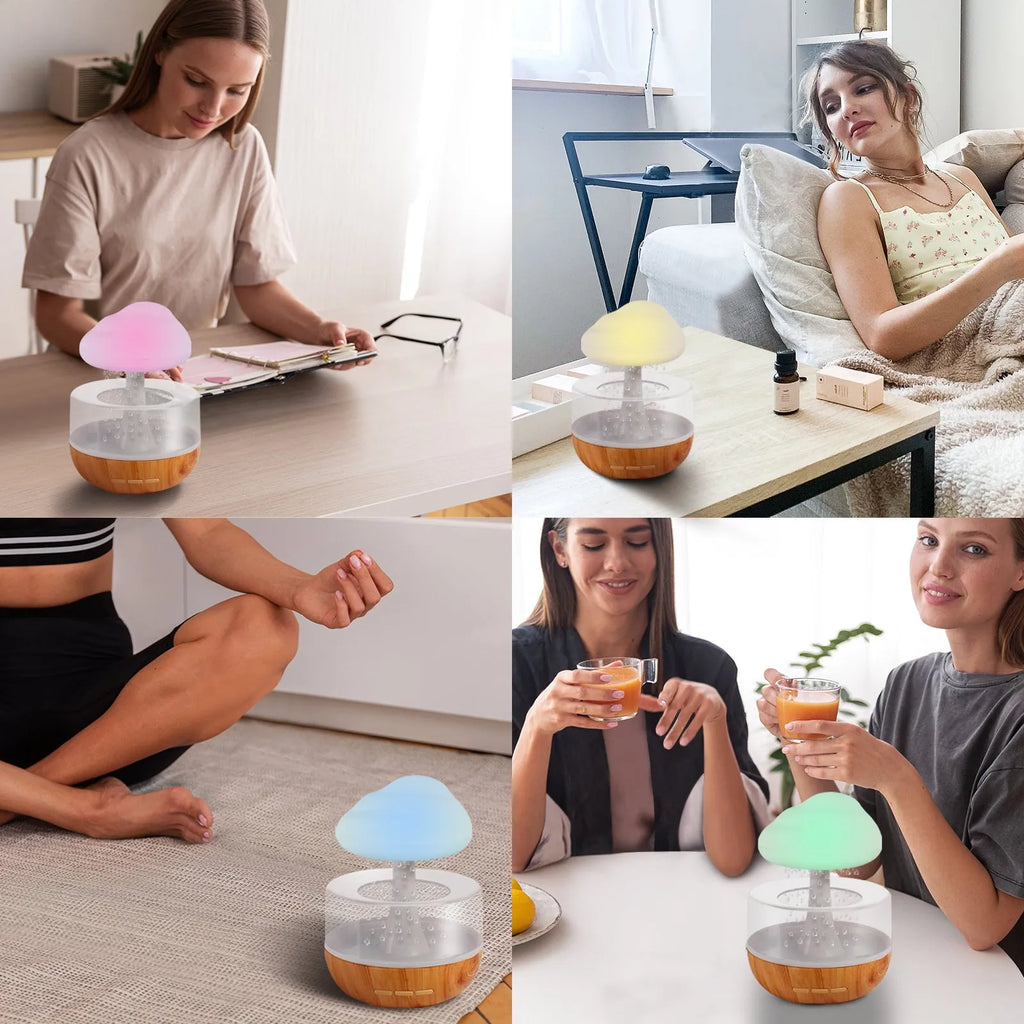 White cloud-shaped ultrasonic humidifier with coloured LED night light on a table.