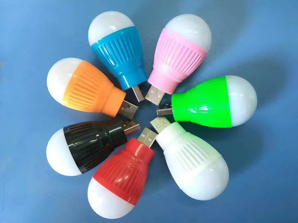 Mini USB night light with ABS plastic shade and metal lamp holder, low power LED, random colour, on desk near laptop