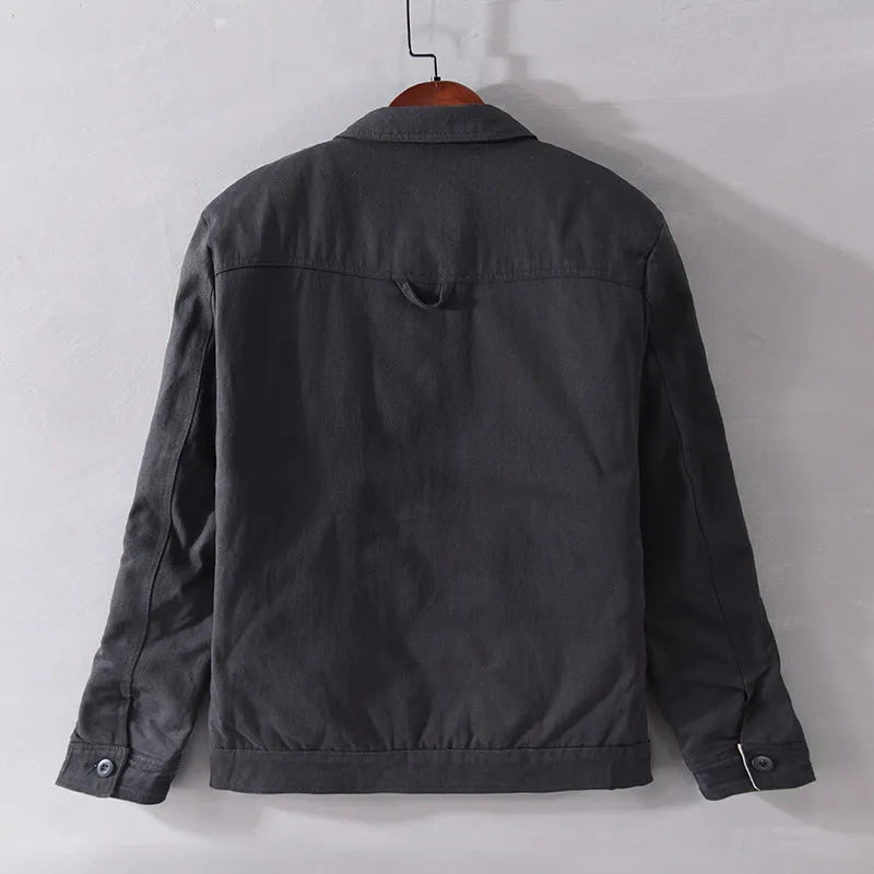 Men's black striped contrast jacket with zip front, cotton filling, side seam slip pockets, and straight hem.