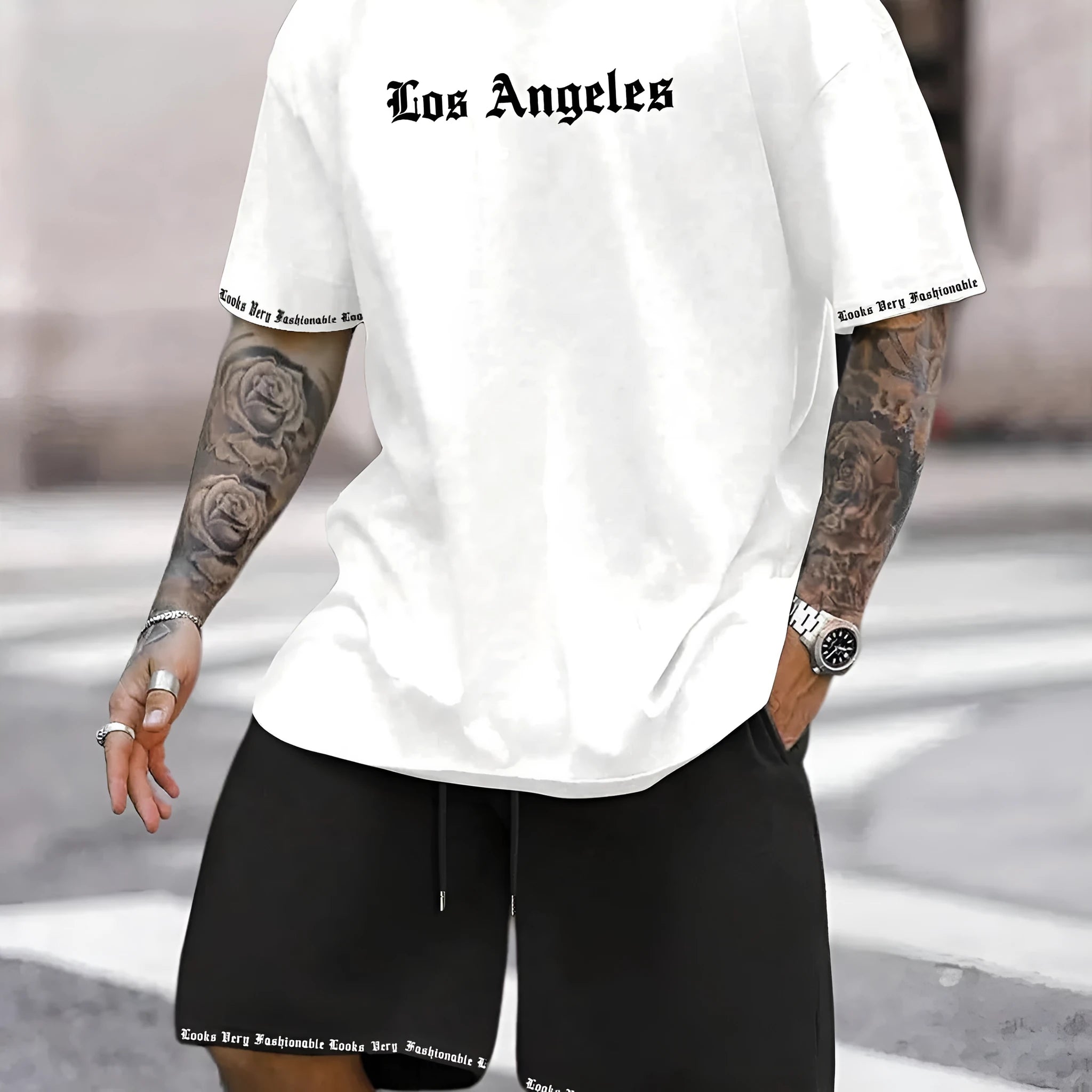 Men's blue sports style short-sleeved top and matching shorts laid flat