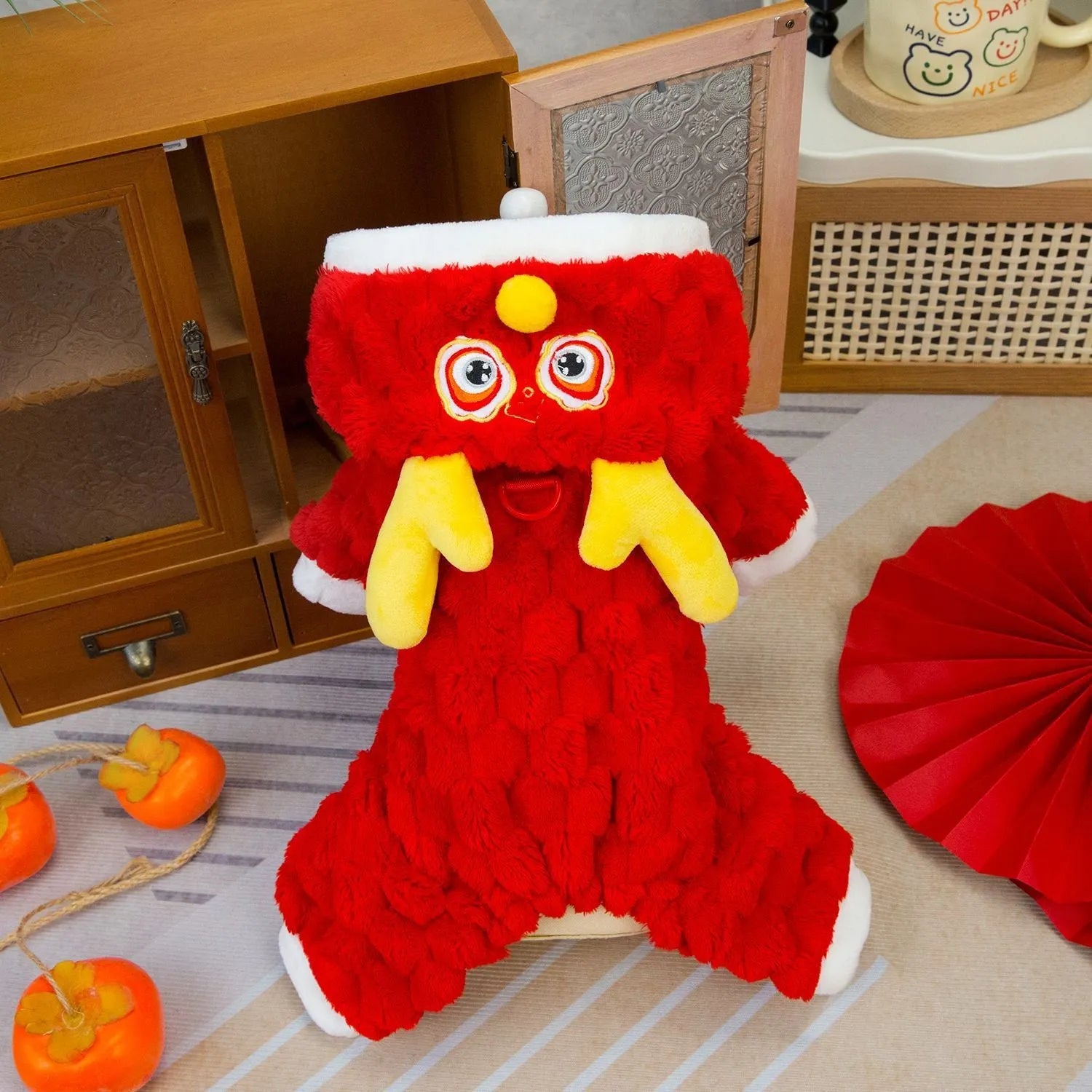 Red velvet dog jacket with cartoon dragon design for festive pet wear