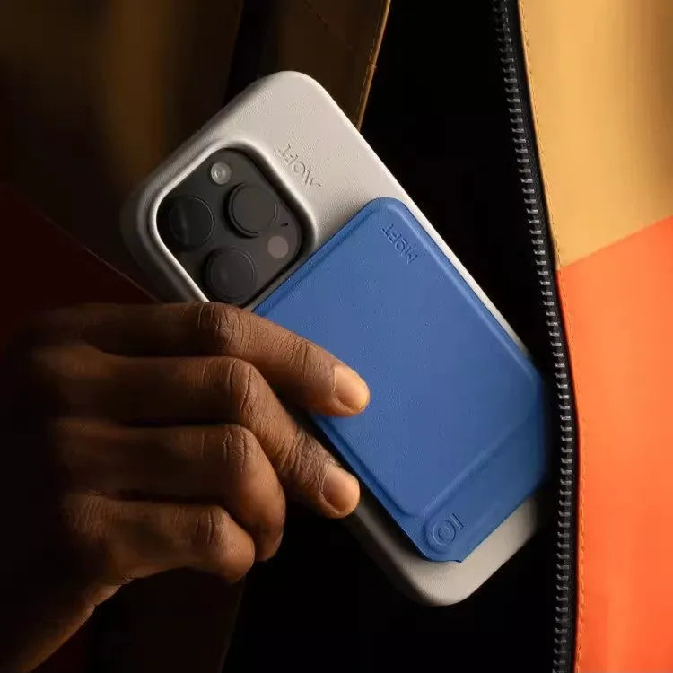 Magnetic mobile phone case holder in leather and fibreglass, shown in black, blue, green, and grey colour options.