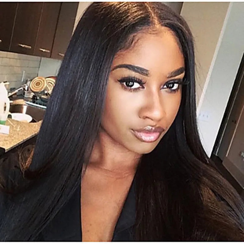 Long straight black synthetic wig with centre-parted fringe on a model