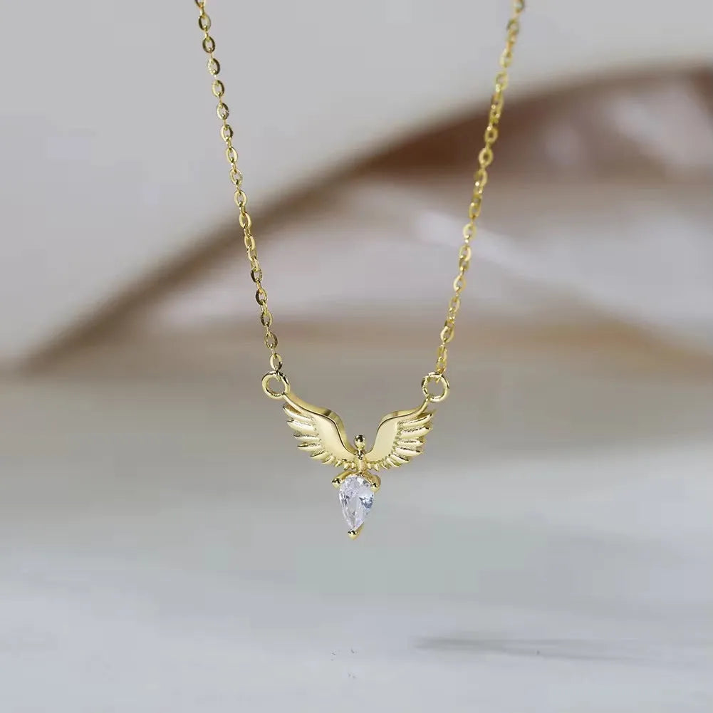 Close-up of an adjustable sterling silver necklace with an eagle pendant on an O-ring chain, showing white gold and yellow gold colour options.