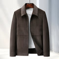 Men's slim fit casual jacket in dark blue, shown on a model, featuring a classic collar and no hood.
