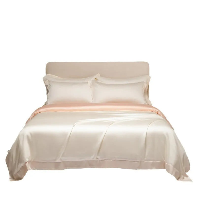 Aurora Blue 200 thread count Tencel duvet cover, fitted sheet, and pillowcases laid on a modern bed.