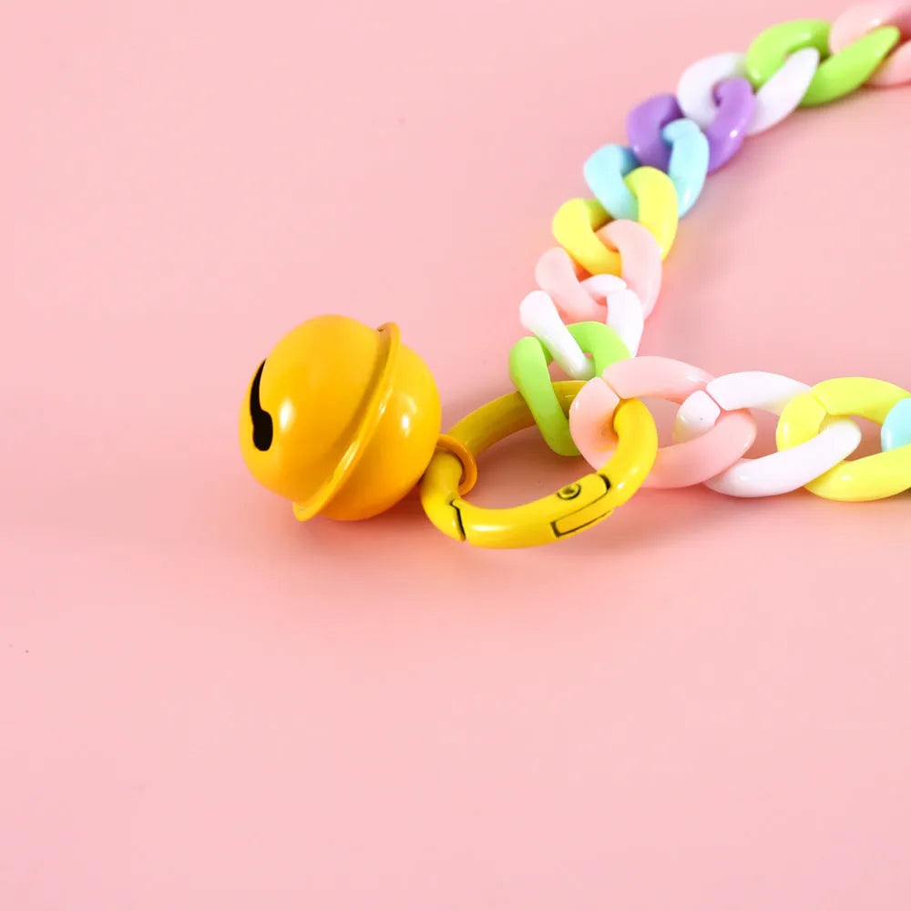 Soft plastic pet collar in pastel macaron candy colours with a chain-link design, shown in S and M sizes.