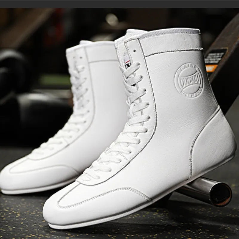 Professional black and gold mesh boxing shoes with a non-slip rubber sole for indoor training.