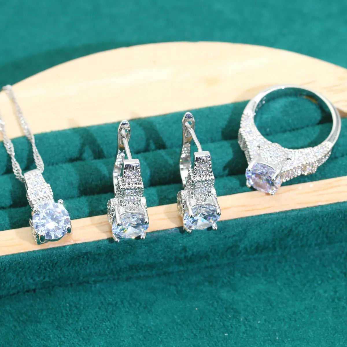 Bridal zircon necklace, bracelet, earrings, and ring four-piece jewellery set in alloy.