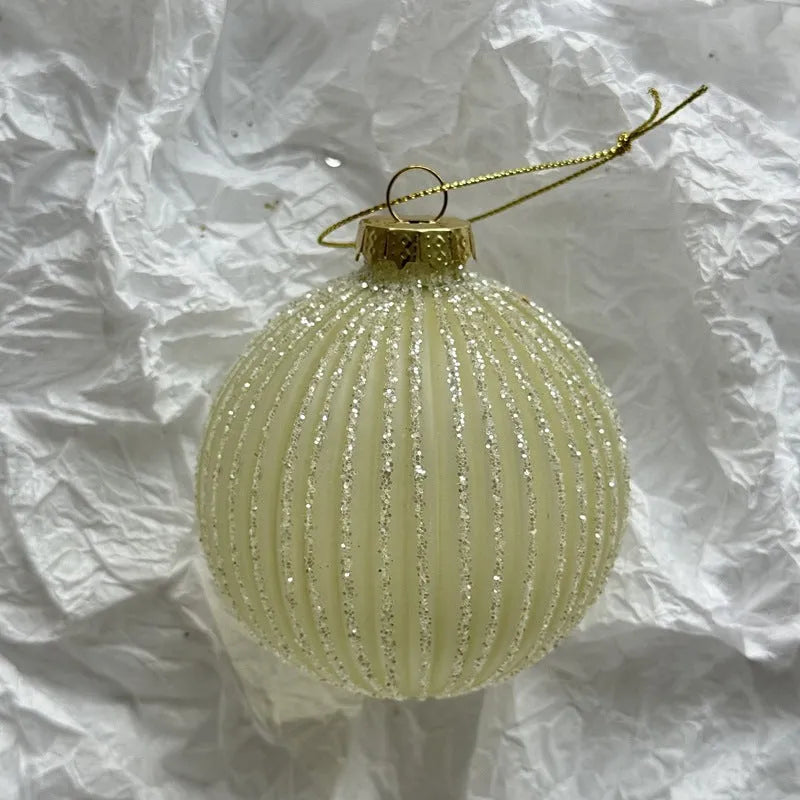 Handmade glass Christmas bauble 8cm diameter in green on branch