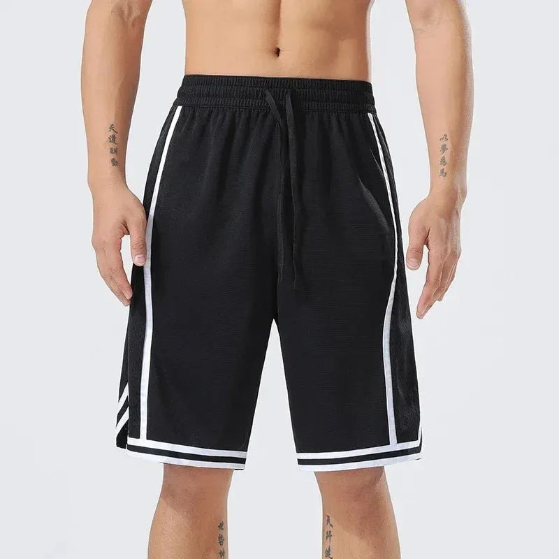 Man wearing straight-leg polyester sports shorts in a colour from the LLMNBAI range, demonstrating a stretch during exercise.