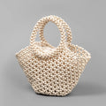 Hand-woven wooden bead beach bag in dumpling shape with strapless design.