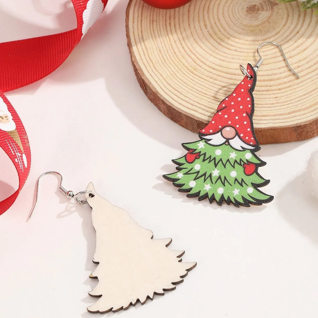 Pair of wooden geometric Christmas earrings with Santa Claus design in red and green colours.
