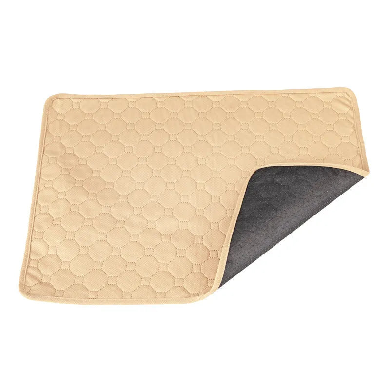 Washable dog pee pads in grey and tan colours showing waterproof backing and triple-stitch edges