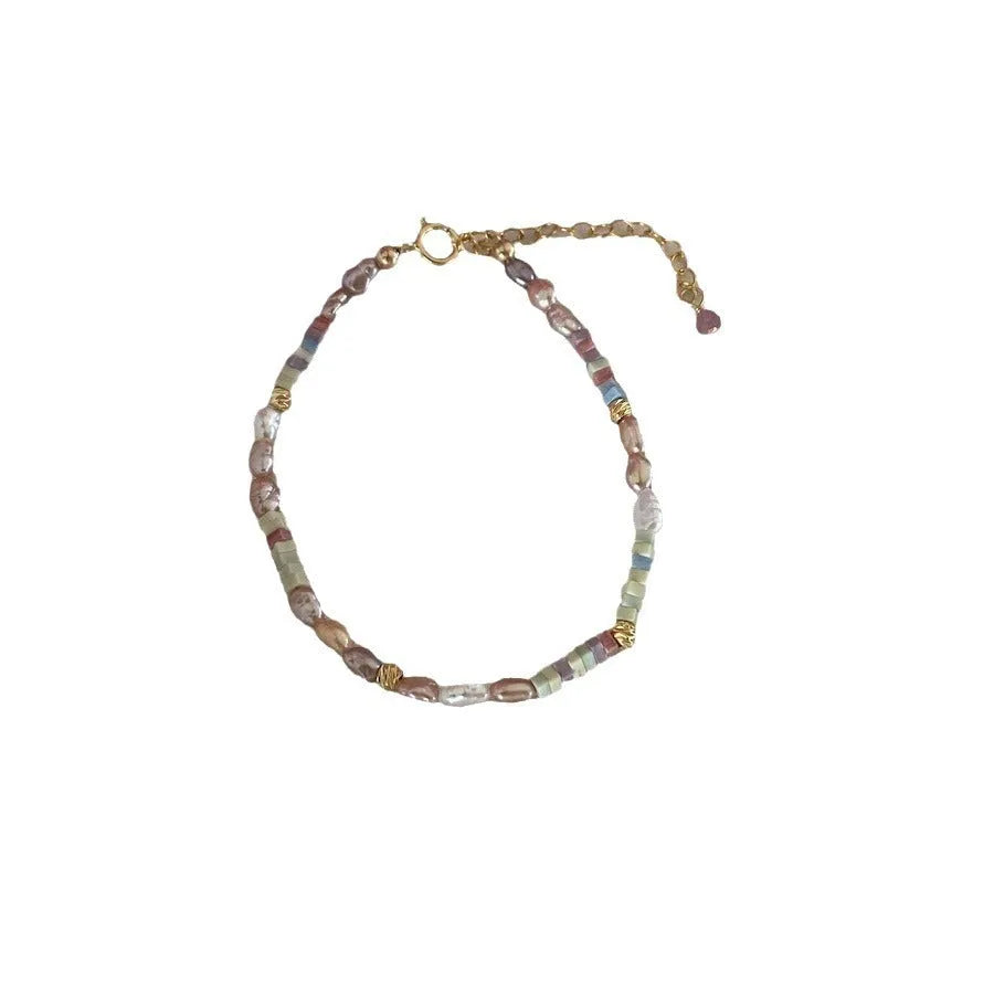 Women's natural pearl bracelet and necklace set with silver pearls and gilded purple 14K plating.
