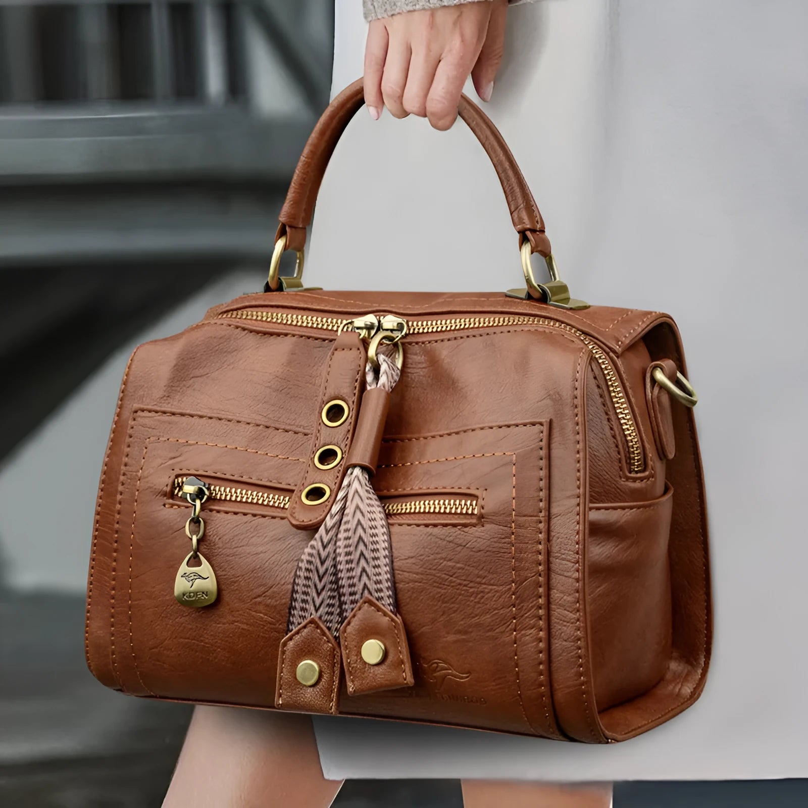 A soft PU leather women's one-shoulder crossbody bag in a horizontal square shape with retro styling.