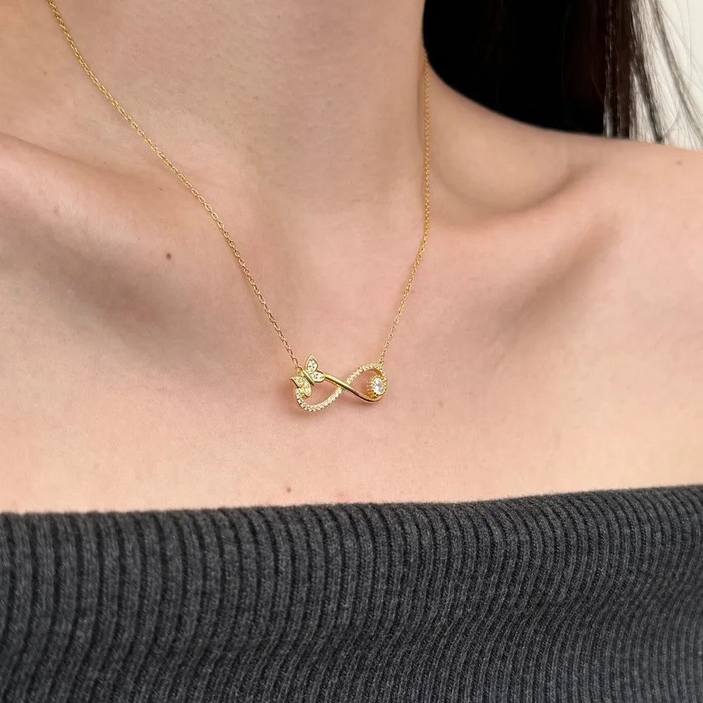 Mobius bow zircon clavicle chain in 925 sterling silver with electroplated gold or platinum finish and butterfly design