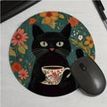 Cartoon black cat non-slip absorbent mouse pad on a desk with a computer