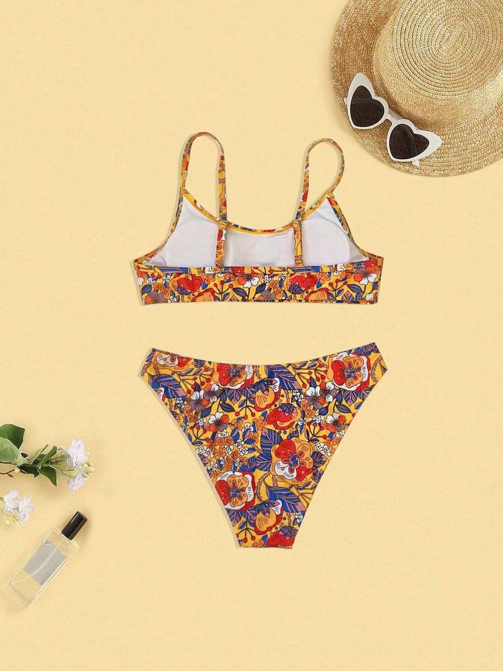 Plus size floral print women's bikini swimsuit with adjustable straps.
