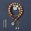 Hand-woven ebony double ring bracelet with traditional jade beads and Ruyi charm elements