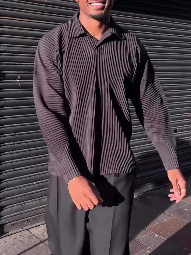 Black men's pleated long-sleeved casual top made from polyester fabric.