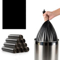 Roll of large black disposable kitchen bags with flat mouth opening, measuring 50cm by 60cm