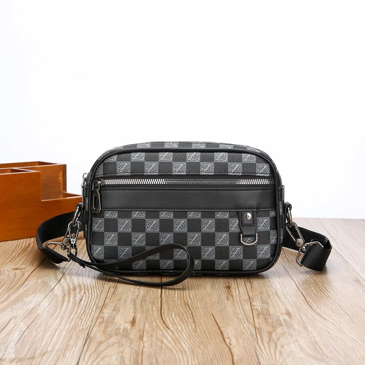 Men's black PU leather messenger bag with geometric pattern lining and shoulder strap