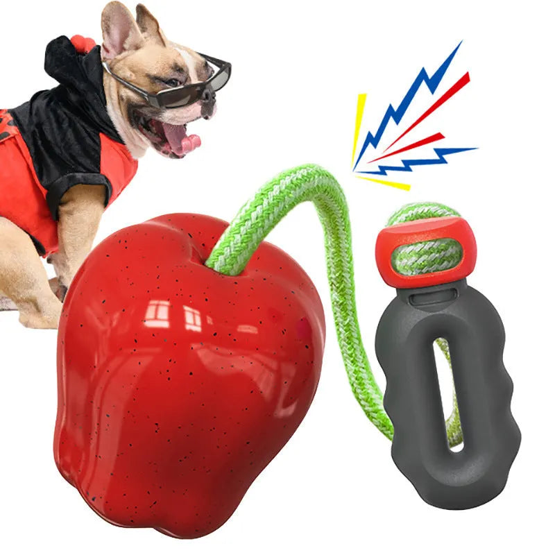 Green plastic dog toy shaped like an apple with a treat-dispensing ball feature.