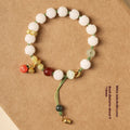 White jade bodhi bracelet with lotus and pumpkin beads on open rope
